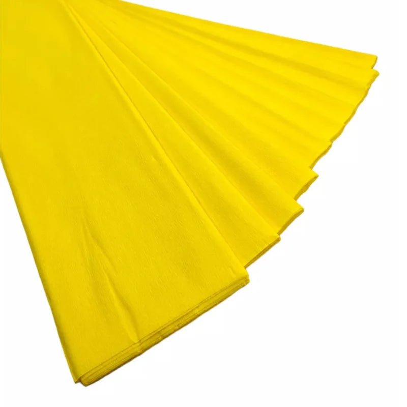 Papel crepé amarillo de 50x200 cm, ideal para decoraciones y manualidades. ¡Encuéntralo en Officemate!