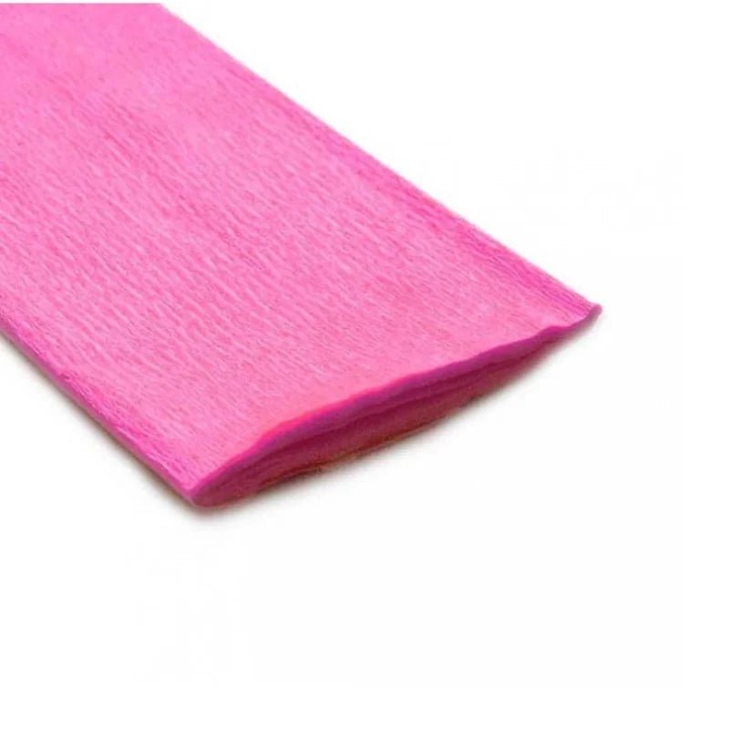 Rollo de papel crepé rosado Artesco, perfecto para manualidades y decoraciones vibrantes. ¡Encuéntralo en Officemate!