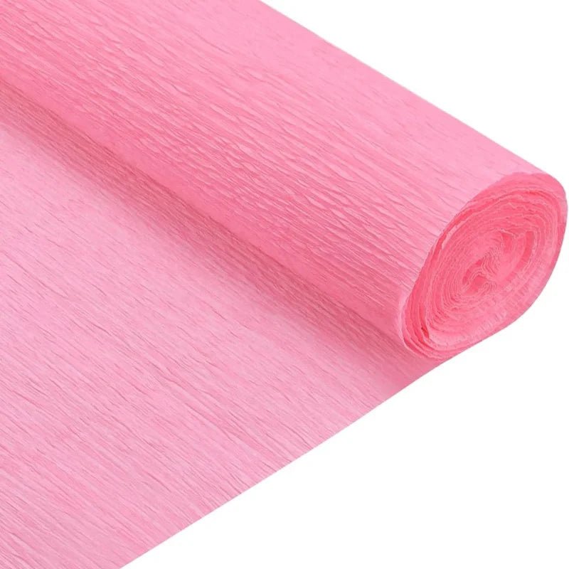 Rollo de papel crepé rosado claro Artesco, ideal para decoraciones y manualidades elegantes. ¡Disponible en Officemate!