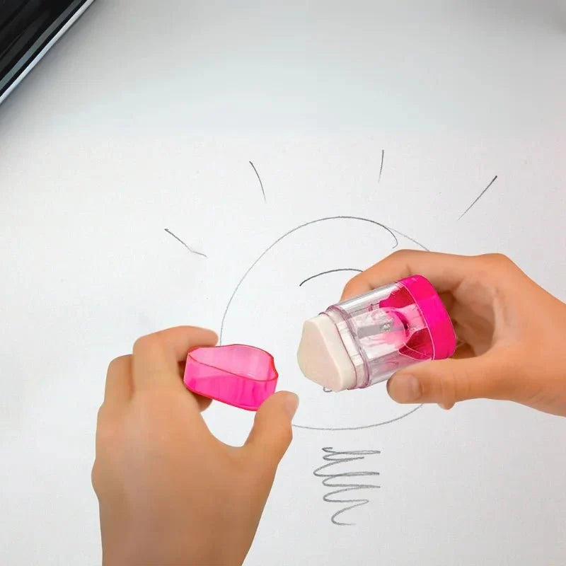 Sacapuntas con borrador Pointer rosado en uso, borrando un dibujo a lápiz sobre papel